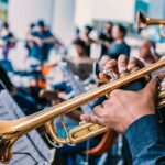 person playing gold trumpet photo – free trumpet image on unsplash 2023 11 04 22 28 53